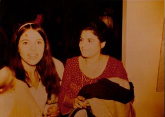 Color photograph of Eva Hesse and Rosie Goldman at the opening of "Eccentric Abstraction"