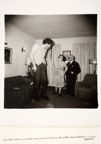 This is Eddie Carmel, a Jewish Giant, with his Parents in the Living Room of Their Home in the Bronx, NY, , from the portfolio A Box of Ten Photographs