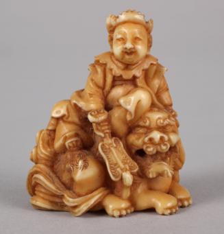 Netsuke of a Figure Riding on a Lion