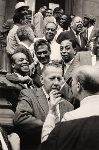 First Row:  George Wettling and Bud Freeman; Second Row:  Jo Jones, Gene Krupa, and Sonny Greer; Third Row:  Miff Mole, Zutty Singleton, Red Allen, Taft Jordan;  Top Row:  Dickie Wells, Buck Clayton, Benny Golson, Art Farmer, Hilton Jefferson, Art Blakey.  Esquire Magazine Shoot, Harlem, New York City