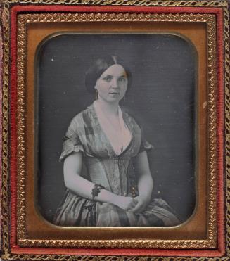 Portrait of Young Woman with Drop Earrings and Bracelet