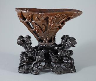 Libation Cup with Squirrel and Grape Motif, on a Carved Wooden Stand