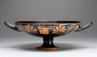 Kylix with Palmette-Eye Motif, depicting a Reclining Youth Playing the Game of Kottabos