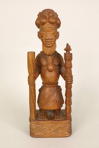 Standing Priest or Shaman Holding Sacred Staffs