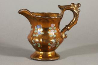 Luster Pitcher with Decorative Handle and Flower Design