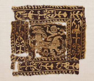 Tunic Medallion Decorated with Animal, Armed Figure and Stylized Vine Border