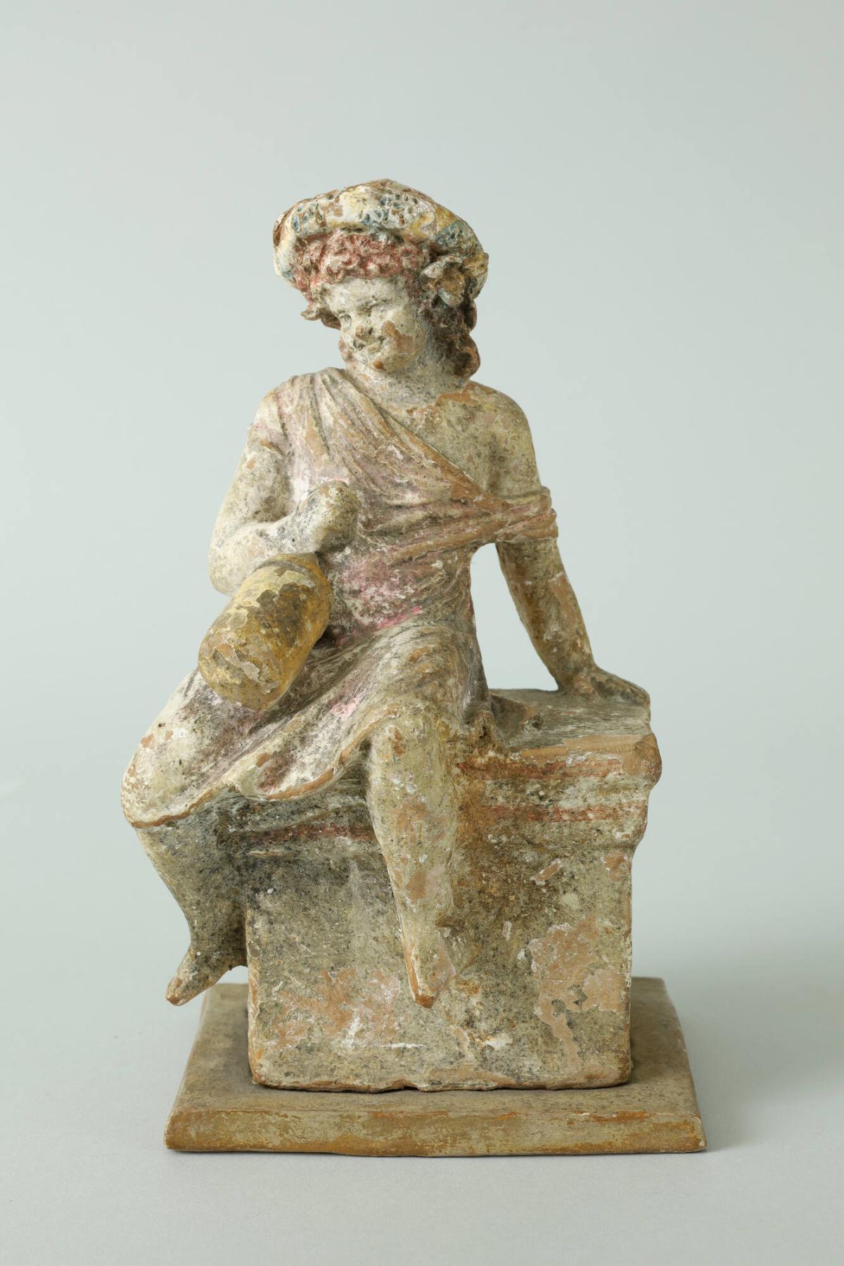 Boy Seated on a Cippus