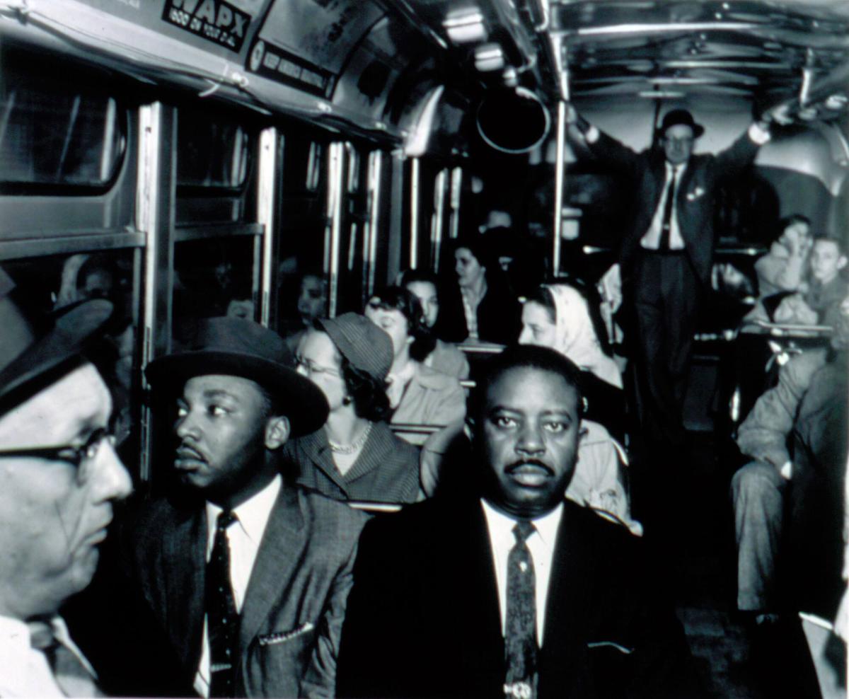 First Desegregated Bus Ride: Dr. Martin Luther King and Rev. Ralph Abernathy on first desegregated bus, Montgomery, Alabama, December 1956, from the portfolio I am a Man