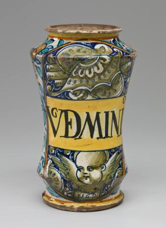 Maiolica Apothecary Jar with Floral Decoration and Medallion of a Cherub and Trophies